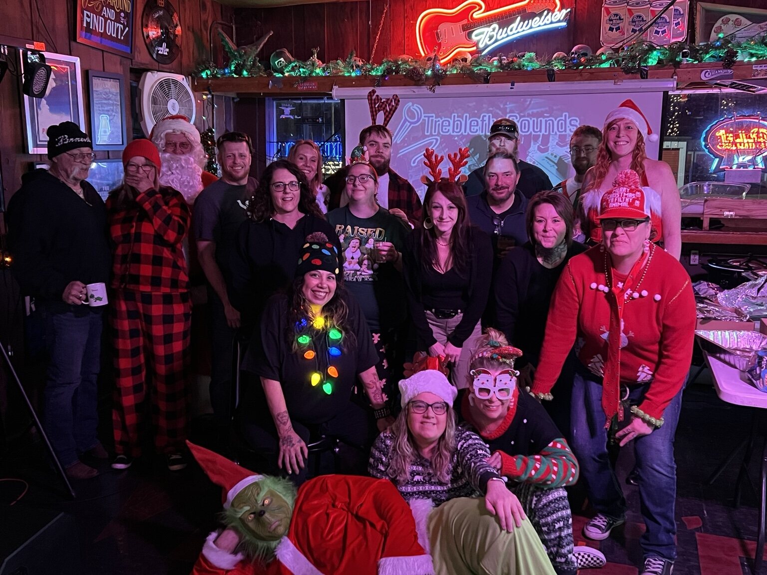 A large Christmas celebration group at Vinnie's Longbranch