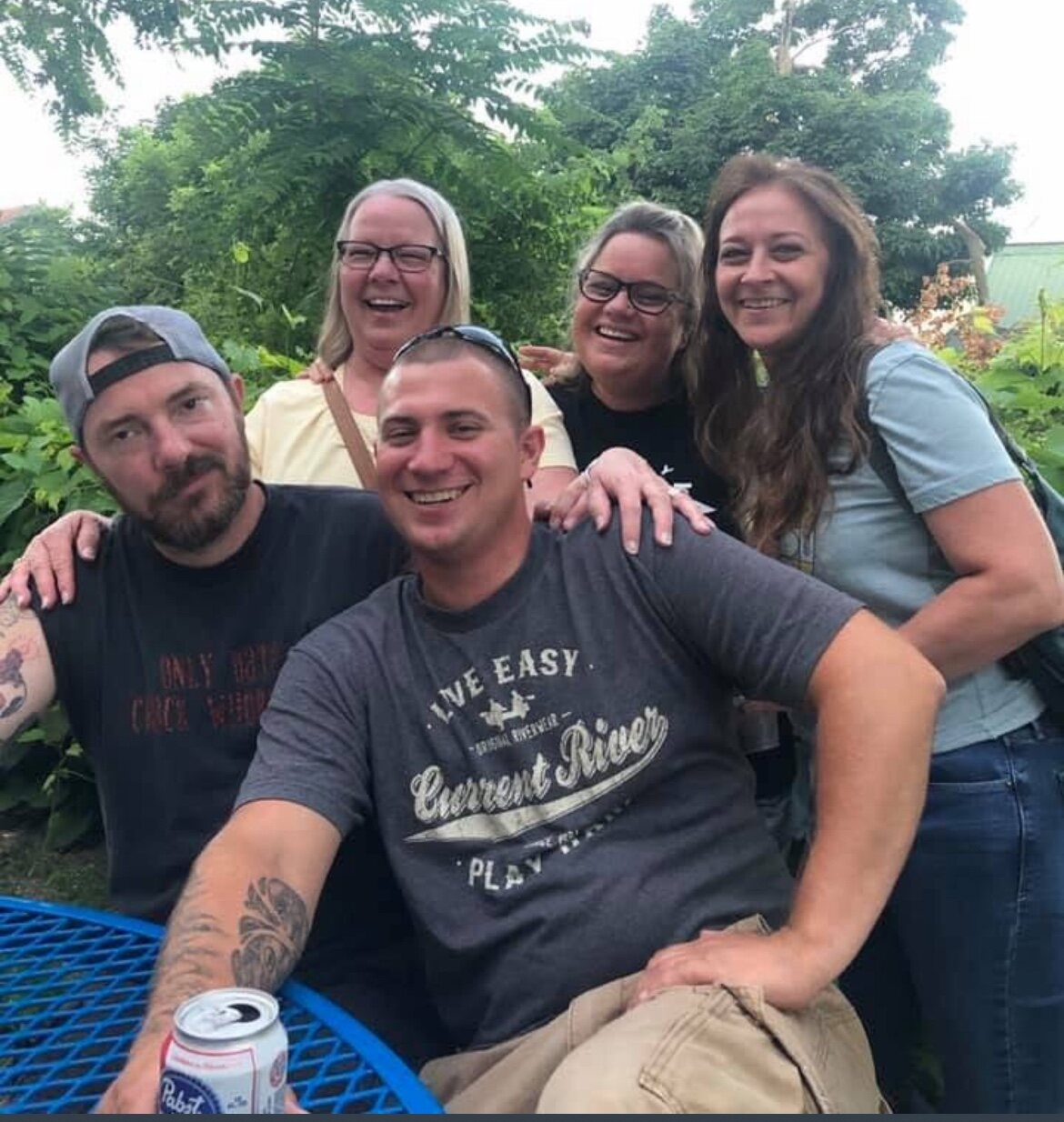 A group of friends gathered outdoors