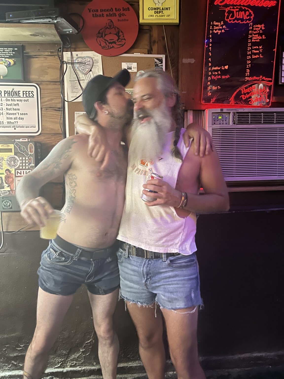 Two friends sharing a funny moment at Vinnie's