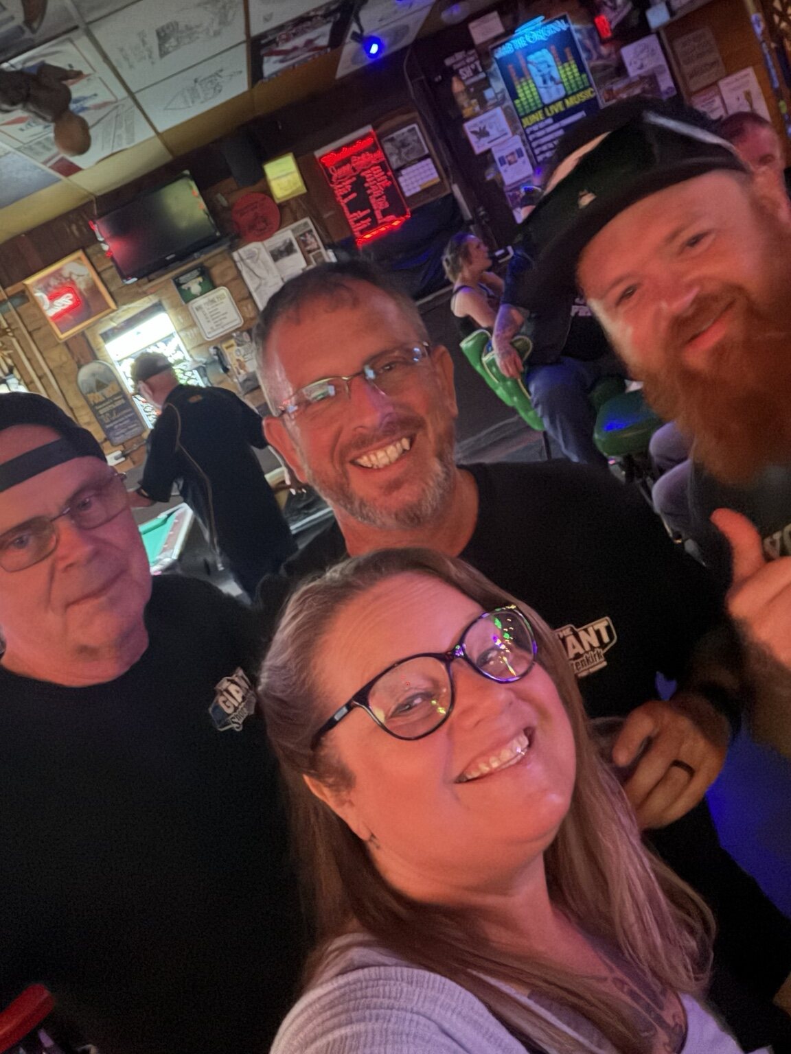 Friends taking a group selfie at Vinnie's